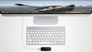 Leap Motion Controller vor einem iMac