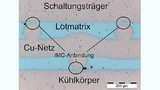 Metallografischer Schliff einer diffusionsgelöteten Fügestelle mit eingebautem Cu-Netz.