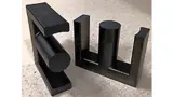Beispiel für einen E-förmigen Ferritkern von Magnetics mit 70 × 54 mm² Kantenmaß.