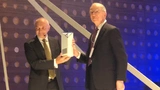 IMEC CEO Luc van de Hove presents the liftetime innovation award to Dr. Irwin Jacobs.