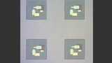 Optische Bilder zeigen Schaltungen des Forscherteams, die an nur wenige hundert Nanometer großen Partikeln befestigt sind. 