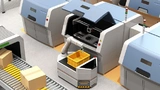 Bild 2. Führerloses Transportfahrzeug (Autonomous Guided Vehicle, AGV) mit einem Cobot zur Entnahme von Werkstücken aus einem Metall-3D-Drucker.